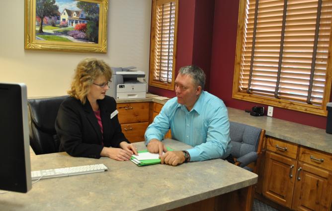 Marketing Agency - Kip Nield with client reviewing market research
