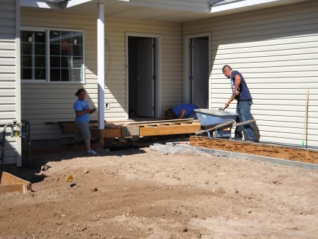 Volunteers work together to install weedblock 