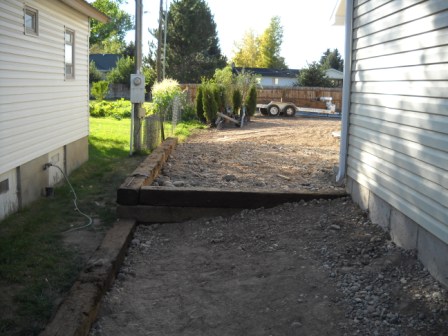 Two volunteers built a retaining wall