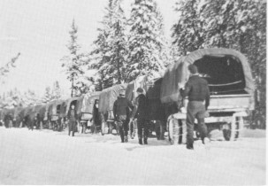 C.C.C. trucks and crew going into the dam. 1935